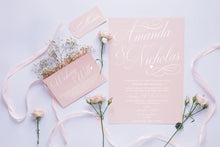 Classic swirl blush wedding invitation features small heart.