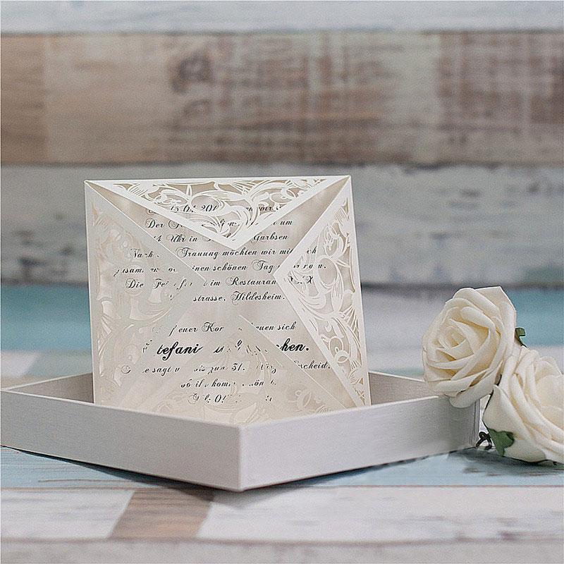 white laser cut wedding invitation