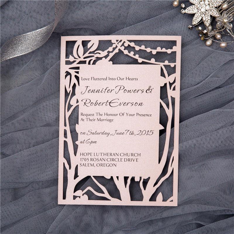 flat laser cut invitation with rustic tree string lights