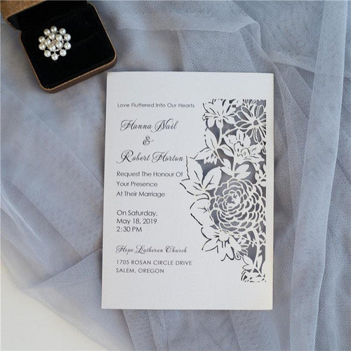 flat laser cut invitation with floral design