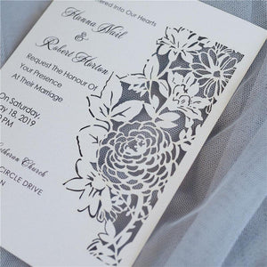 flat laser cut invitation with floral design