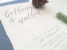 Simple yet elegant wedding invitation on deckled edge paper